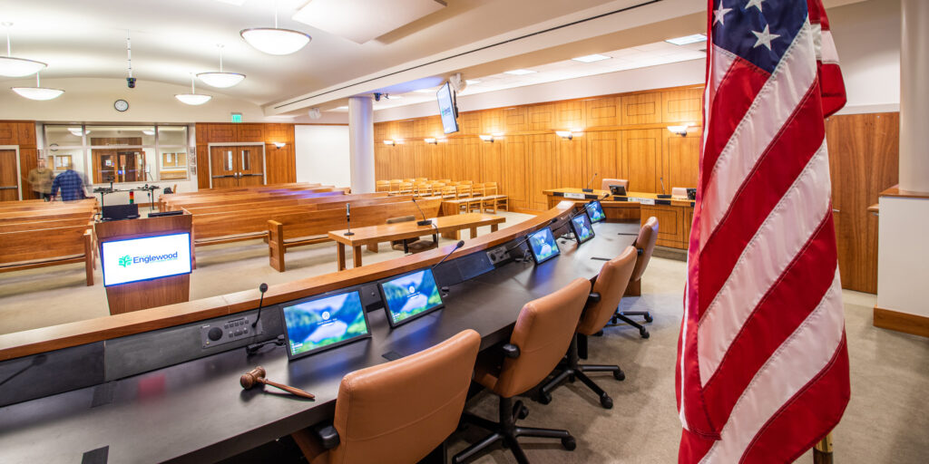 High-definition AV setup with video wall and digital signage in a modern council chamber