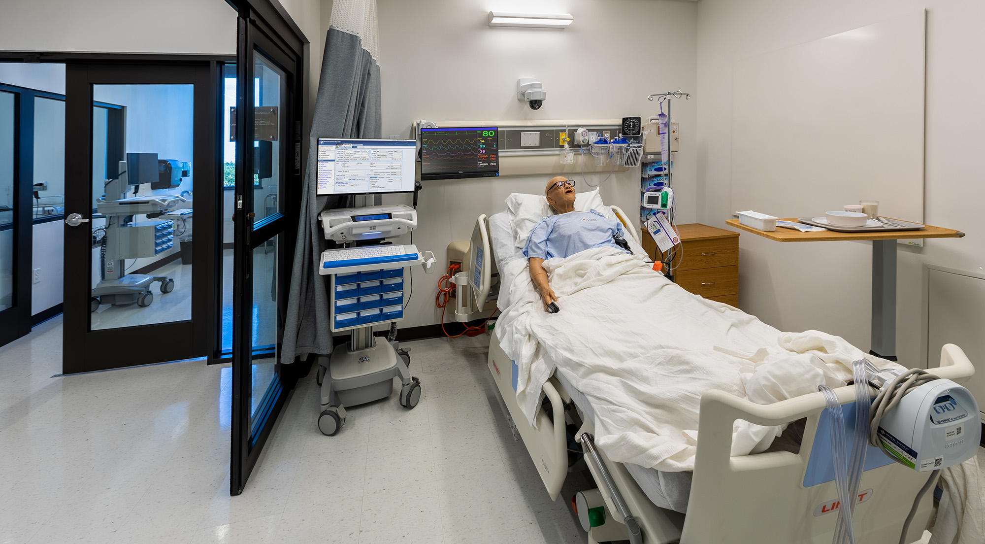 High-fidelity nursing manikin in emergency room simulation bay