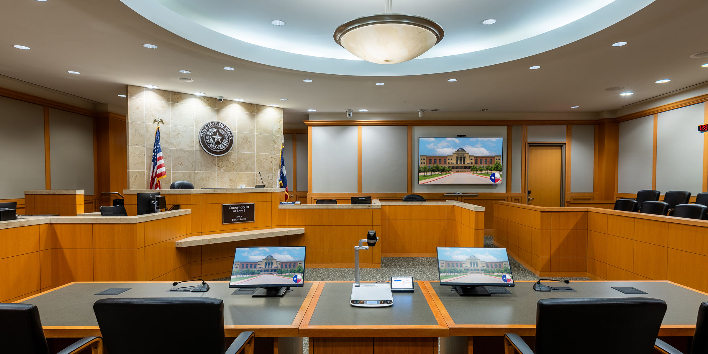 Government courtroom AV installation with ceiling microphones and speakers
