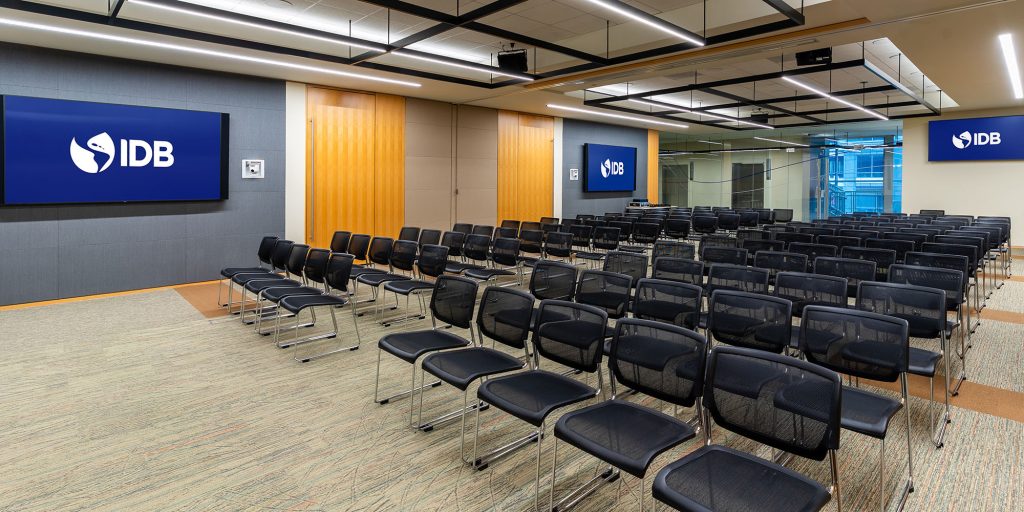 Divisible conference room with integrated AV systems, LED display walls, and hybrid collaboration technology for international meetings.