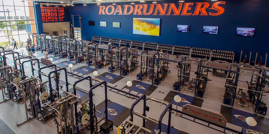 Large-format video wall in UTSA athletics training facility weight room
